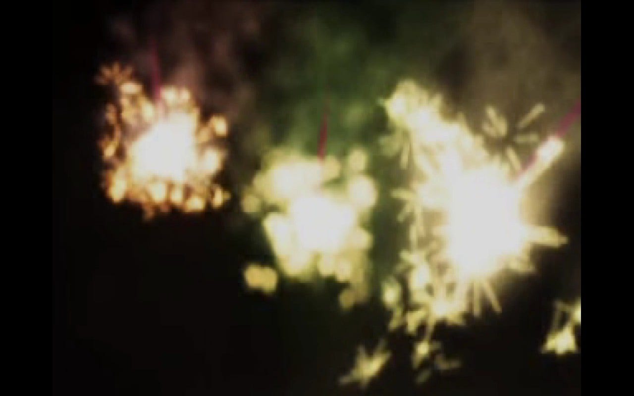 Screenshot of a prerendered cutscene with sparklers and fireworks.